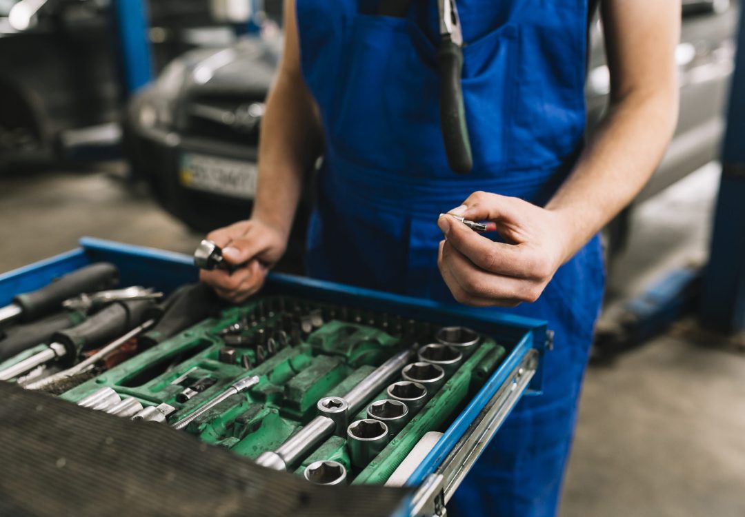 auto-mechanic-s-hand-holding-spanners